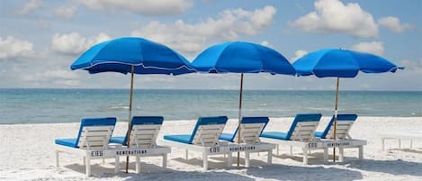 Complimentary Daily Beach Service with Chairs & Umbrellas year round excluding Thanksgiving and Christmas days