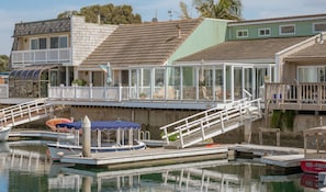 Private L-shaped boat dock accessible from the relaxing and spacious back deck!