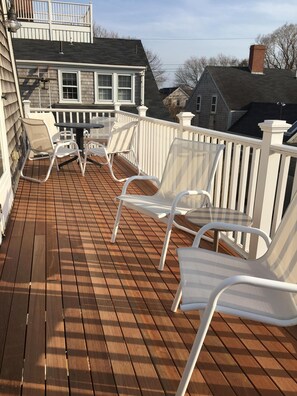 Beautiful mahogany sun deck with dining & lounge sets (sun umbrella not shown)..
