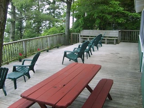 Front  deck with chairs and picnic  table.
