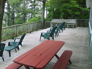 Front deck with chairs and picnic table.