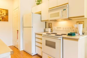 Kitchen includes an island for additional space.