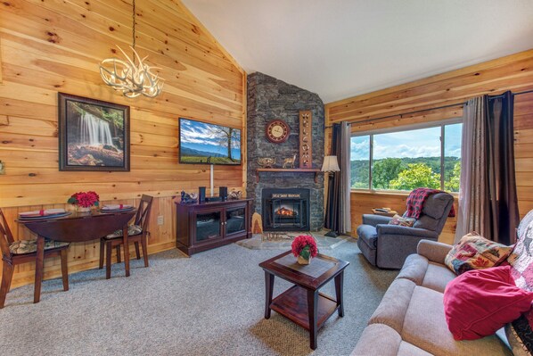 Stone fireplace with electric insert lends a romantic atmosphere