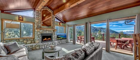 Welcome to the living room with spectacular views and cozy fireplace.