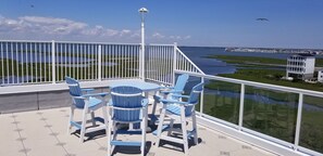 1 of 2 beautiful dining sets overlooking the bay to enjoy drinks and snacks.