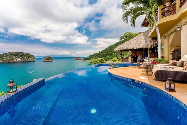 Infinity pool with views of Los Arcos