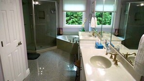 Master bath, with oversized soaking tub. Private toilet room. 