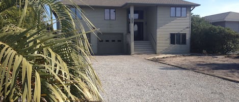 Street view of house and driveway.