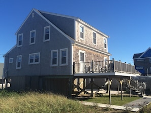 Back of house with spacious deck and gas grill
