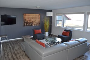 Living room with large windows facing the lake