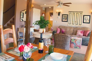 Seating for four, family room, and kitchen all in one room.