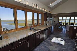Someone has to wash dishes, even on vacation.  With this view, who minds?