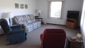 Living Room with TV & Radio. Facing East