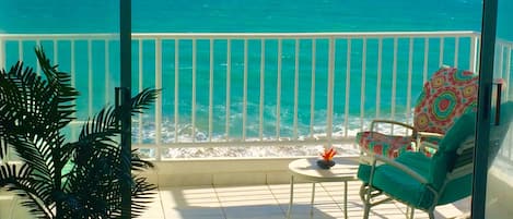 Enjoy the surf on your private balcony right on the beach!