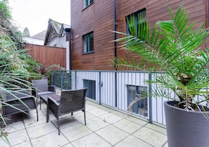 Shared rear terrace with outdoor seating