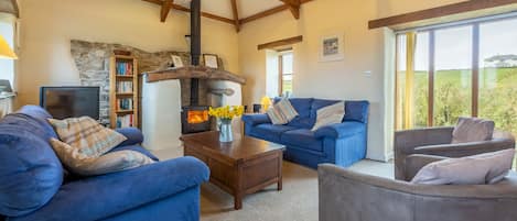 Spring Barn, Rock. First floor: Sitting room with feature fireplace and wood burning stove