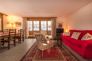 French doors open onto a spacious South facing balcony.