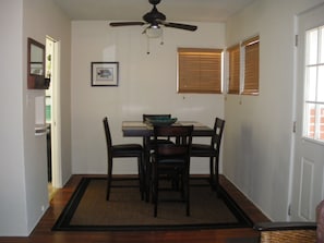 dining room that leads to kitchen and living room