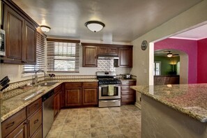 Newly-remodeled kitchen with stainless steel appliances.