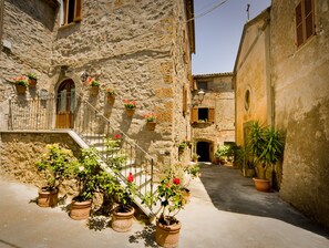 Rocca di Benano's front steps. The village church is the building on the right.