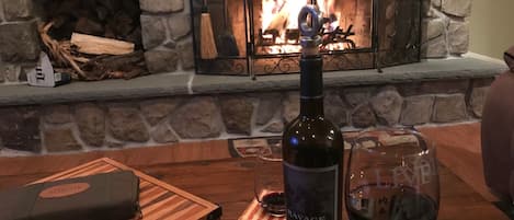 Enjoy a glass of wine in front of the fire! 