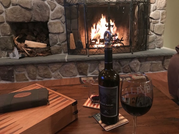 Enjoy a glass of wine in front of the fire! 