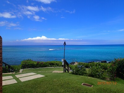 View of ocean, tiki torch and path to the snorkel ladder from the condo