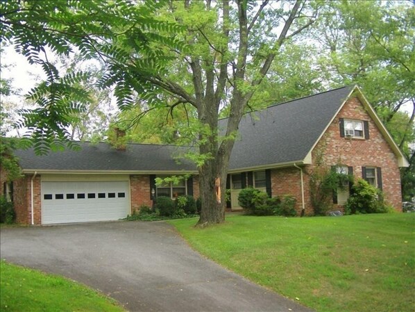 Front of the House. Parking for 4 cars to the left of the garage.
