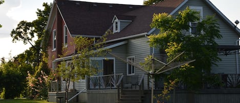 Large century farmhouse with wrap around veranda.