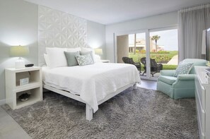 Primary Bedroom with king bed, en suite bath, walk-in closet, and TV with cable.