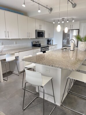 Kitchen with large island and seating for 8.