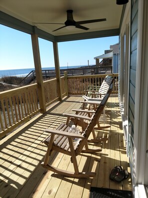 private porch with rocking chairs for beach viewing