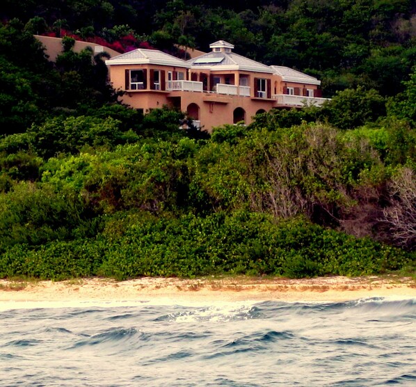 Villa from the water with secluded beach