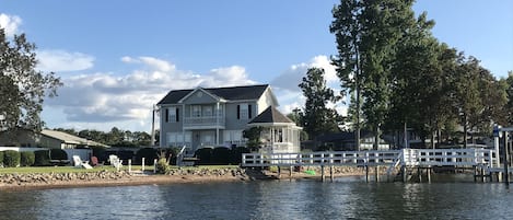 Water view of the home, yard and dock