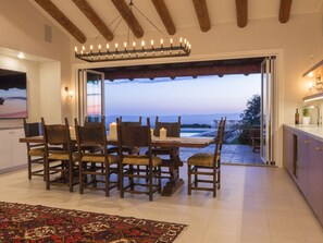 Dining room doors open to the outside patio for indoor/outdoor living.