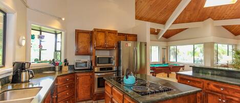 Spacious kitchen that opens up to large entertainment area, with new appliances.