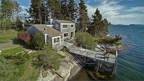 Cottage with deck and water