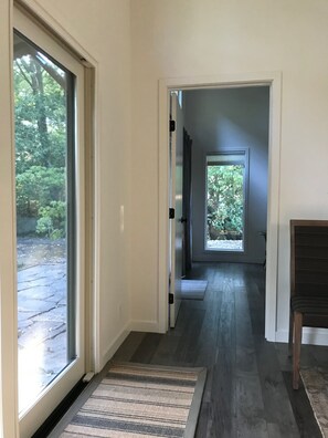 VIEW THROUGH LIVING SPACE THEN BEDROOM