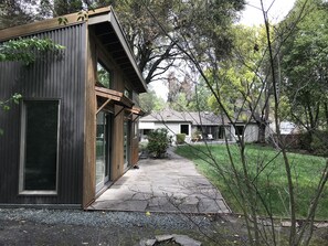VIEW OF HOUSE IN DISTANCE FROM COTTAGE