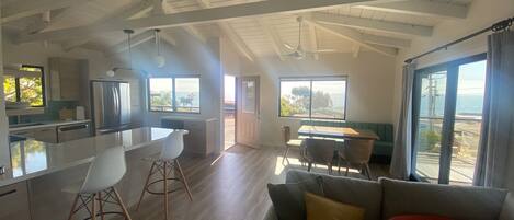 Sun is streaming in! - West facing photo with ocean views from windows and deck