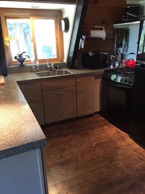 New floors and countertops featured in the kitchen.