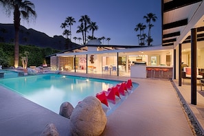 Pool and outdoor patios at dusk