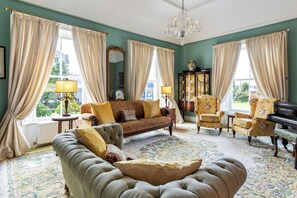 Luxurious Drawing Room with beautiful views of gardens. Filled with light.