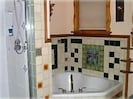 Master tiled bathroom, oversize tub and steam shower