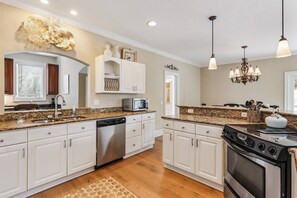 Spacious Kitchen with Pass to Bar!