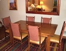 Dining area with leather cushioned seating in the traditional Wyoming style