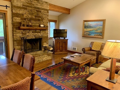 Living Room, Cathedral Ceiling, stacked stone fireplace, Barry's oil painting