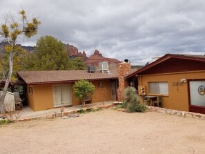 House patio backyard, Fireplace room, Front of Guest House and parking. February