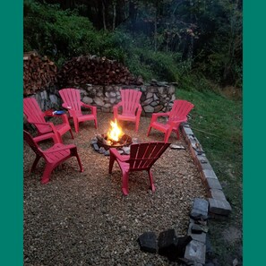 The fire pit area has room for six to eight to relax just outside the cabin door