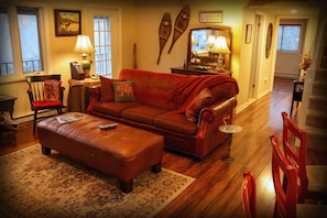 The living room's tasteful furnishings ensure a cozy, comfortable, casual feel.